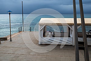 Empty Seaside Cafe on a Cloudy Day