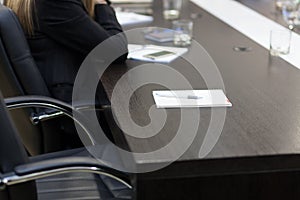 Empty seat at the conference table