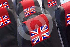 Empty seat in plane with UK Flag. Travel, flight and transportration in United Kingdom concept