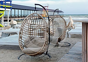 Empty seats and closed umbrellas at Koblevo seaside in Ukraine