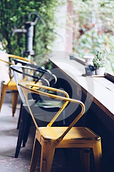 Empty seats at coffee shop, wooden counter table