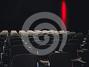 Empty seats in a dark room at a business conference