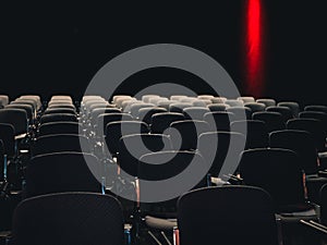 Empty seats in a dark room at a business conference