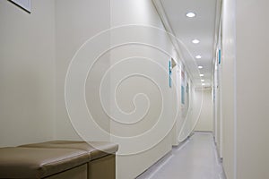 Empty seats in a hospital corridor without people