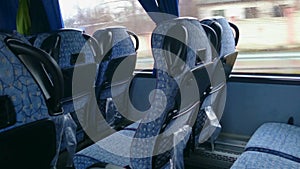 Empty seats inside a low-budget bus, traveling in economy class. Tourism