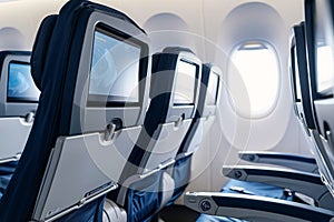 Empty seats near window in airplane cabin