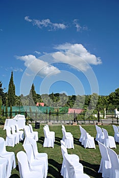 Empty seats at an outdoor wedding