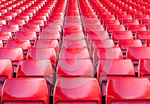 Empty seats red at stadium.