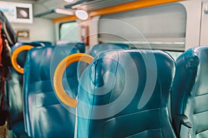 Empty seats in regional train with view through window in Europe. Seats in a train in a row