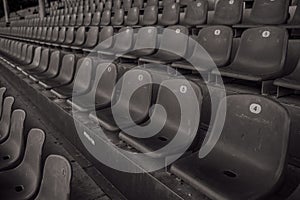 Empty seats in a sports stadium black and white photo