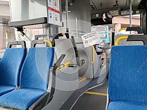 Empty seats in Swedish bus due to coronavirus, 20 may 2020, Gothenburg, Sweden. No entry and exit through the front doors. We keep