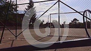 Empty seesaw a football field in the background