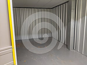 An empty self storage unit room that has been cleared