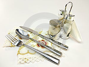 Empty served restaurant table with white tablecloth