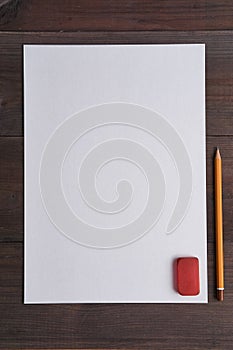 Empty sheet of paper on a desk with pencil