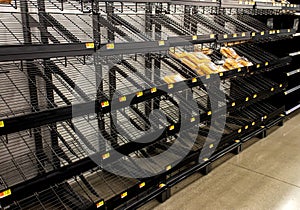 Empty shelves of bread at a supermarket due to stockpiling during the coronavirus pandemic