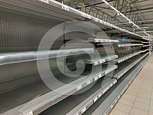 Empty shelves in stores. Empty shelves in stores.Supermarket shelves in perspective.