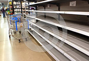 Empty shelves at a supermarket due to stockpiling during the coronavirus pandemic