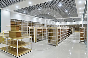 Empty shelves of supermarket interior