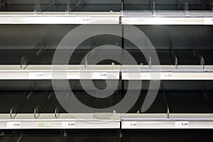 Empty shelves in supermarket after shoppers panic buying and stockpiling during curonavirus crisis, covid-19 epidemic