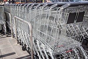 Empty shopping carts in the big supermarket