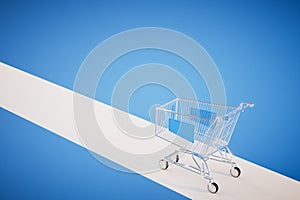 Empty shopping trolley isolated on blue background. 3d render