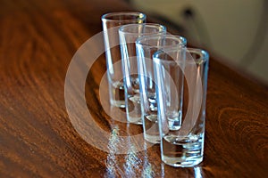 Empty shot glasses on bar counter