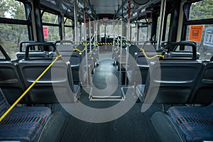 Empty Shuttle Bus Roped Off for Social Distancing photo