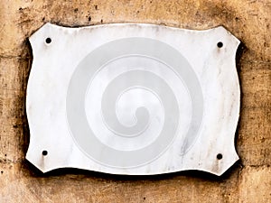 Empty sign on a house wall