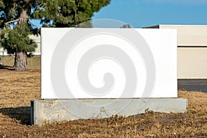 Empty sign post near commercial property