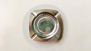 empty silver stainless ashtray isolated on white background