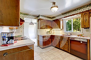 Empty simple old kitchen in American rambler.