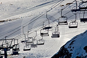 Empty ski lift above the ski slope.