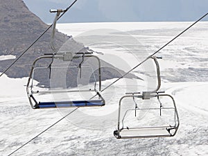 Empty ski lift above snow