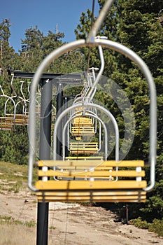 Empty ski lift chairs in a row
