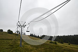 Empty ski lift on the green grassy hill in the Carpathian mountains, Ukraine