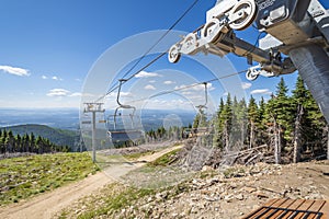 An empty ski lift not operating during summer at the Mt Spokane State Park ski resort overlooking Spokane Washington