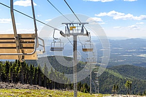 An empty ski lift during summer at the Mt Spokane State Park ski resort overlooking Spokane, Washington.