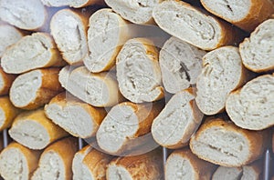 Empty and sliced spanish bocadillos bread ready for fill photo