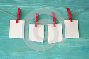 Empty slips of paper hanging on a string, free copy space photo