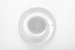 Empty small white porcelain coffee Cup on a white saucer top view isolated on a white background