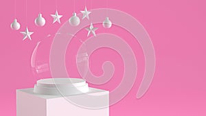 Empty snow glass ball with white tray and podium on pastel pink background with hanging balls and stars ornaments.