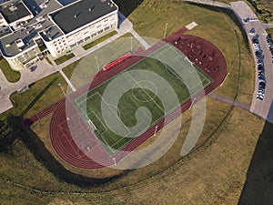 Empty soccer Stadium aerial drone top view green field