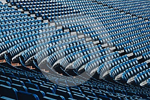 Empty soccer stadium grandstand, blue chairs