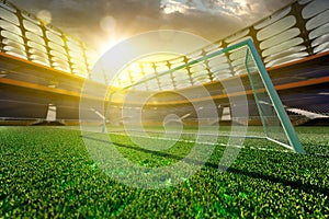 Empty soccer stadium in sunlight