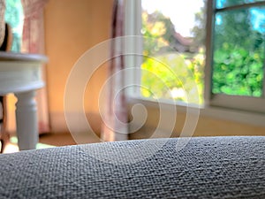 Empty sofa with blurred background with window and garden