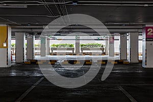 Empty space car park interior at afternoon.Indoor parking lot.interior of parking garage with car and vacant parking lot in parkin