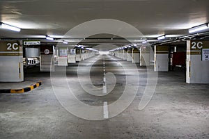 Empty space car park interior at afternoon.Indoor parking lot.interior of parking garage with car and vacant parking lot in parkin