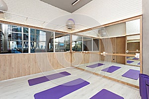 Empty space in fitness center, yoga mats