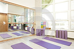 Empty space in fitness center, yoga mats
